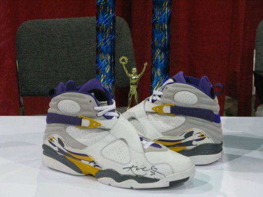 Kobe Bryant wearing number 8 jersey and Air Jordan Retro VIII PE shoes