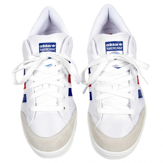 white adidas with blue stripes