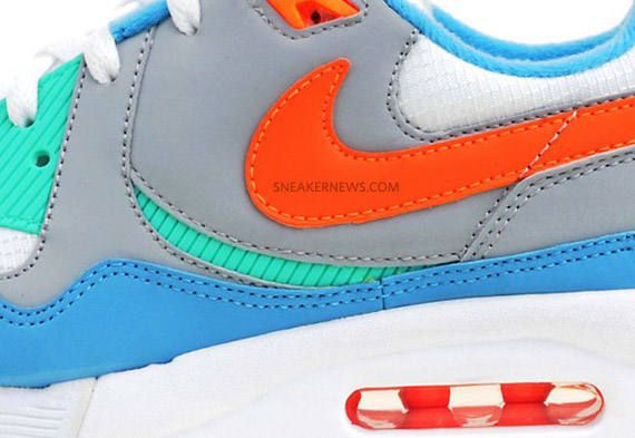 Baby blue and hot sale orange nike shoes