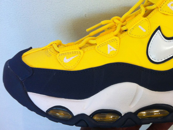 navy blue and yellow sneakers