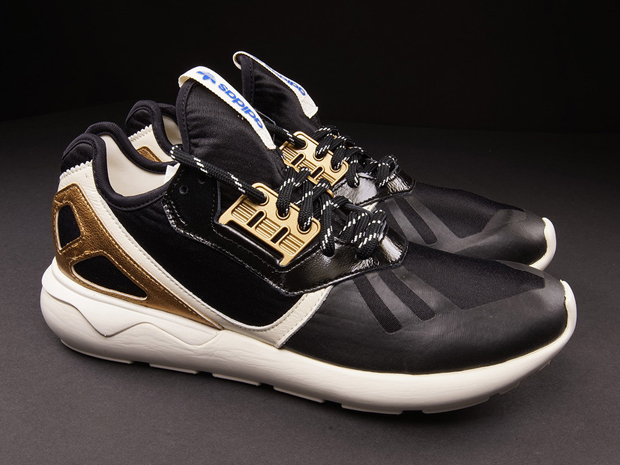 Adidas tubular gold black hotsell