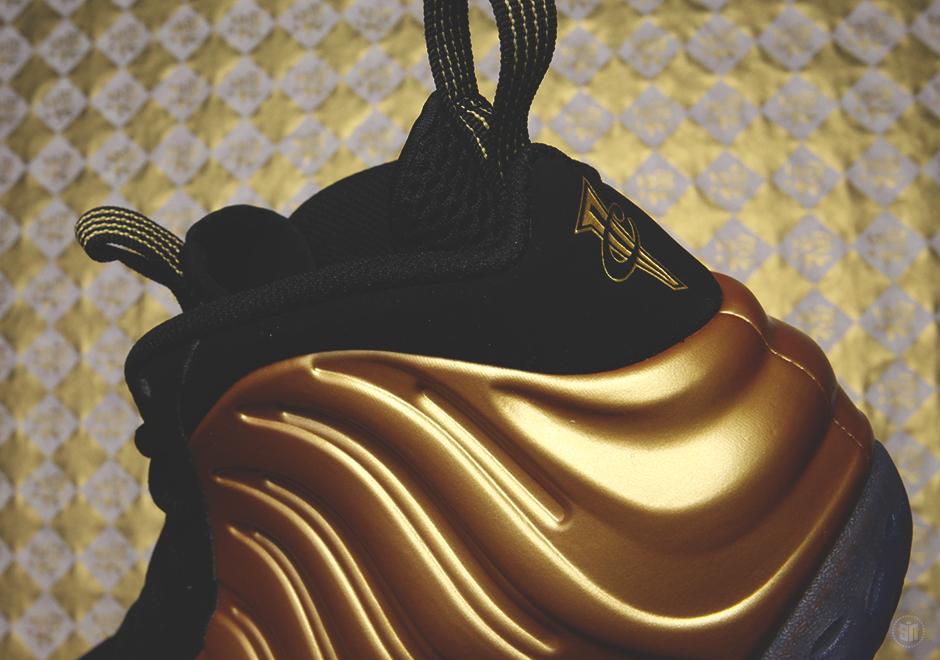 Detailed Look Nike Foamposite One Gold 01