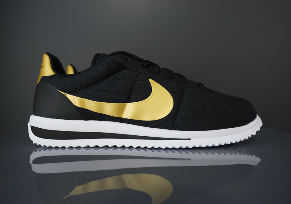 Nike cortez black hot sale with gold swoosh