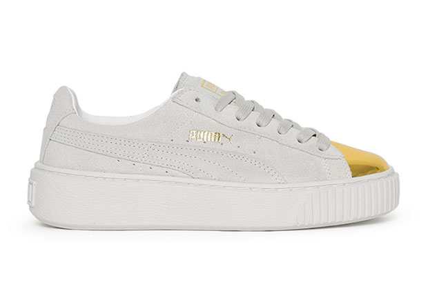 white pumas with gold toe