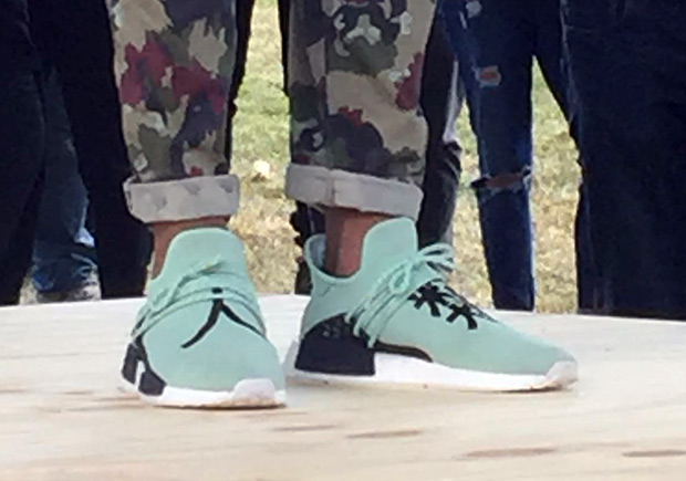 Pharrell Stops By adidas Germany HQ In Mint Green NMD Shoes