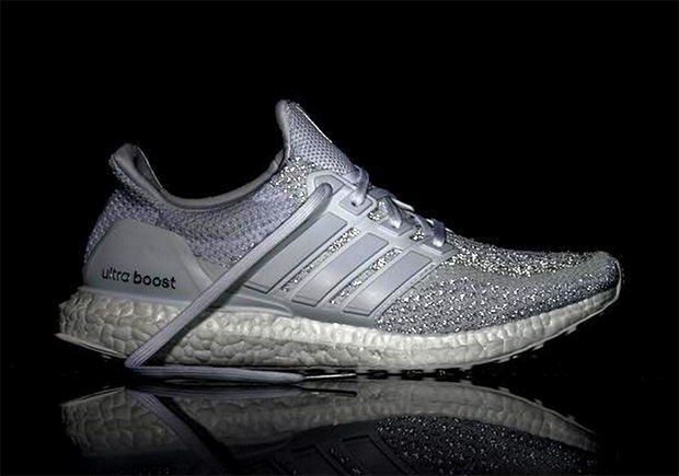 adidas ultra boost white reflective on feet