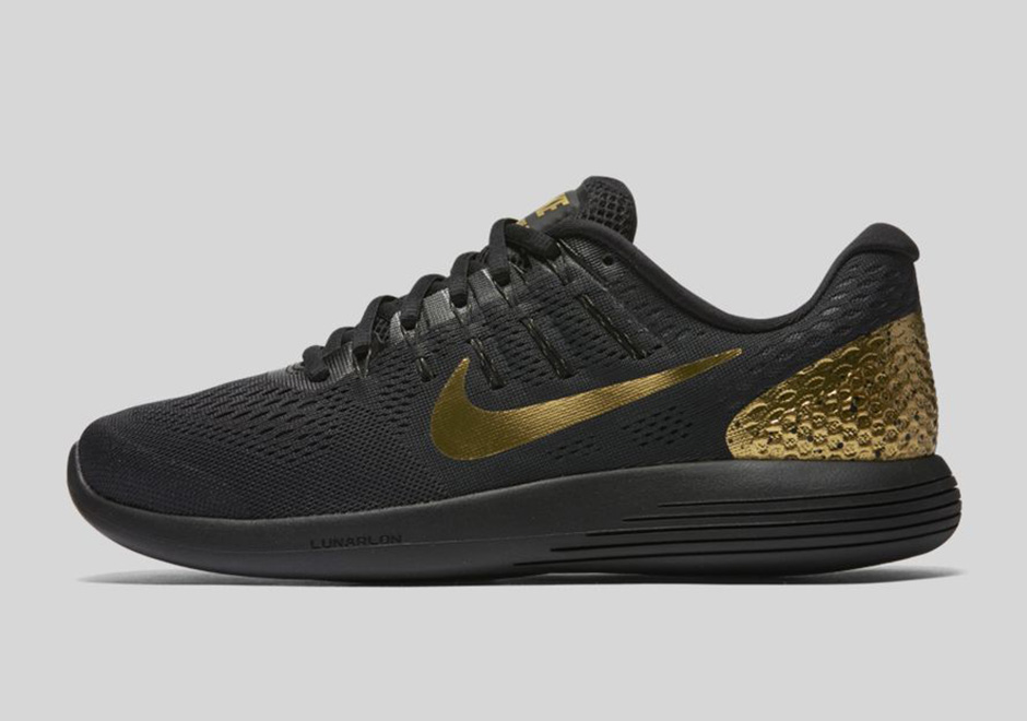 Nike black and gold runners hotsell