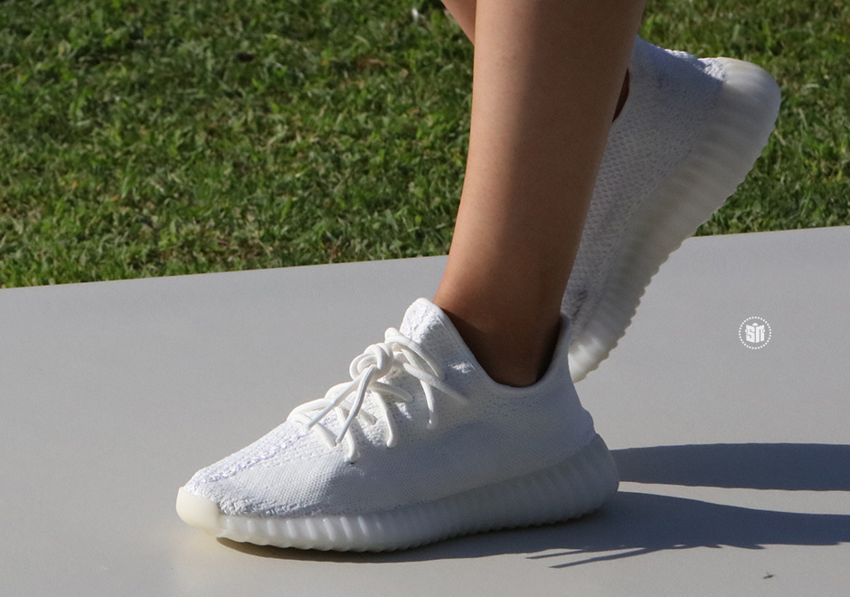 North West wears Kanye West's Yeezy trainers in New York during 
