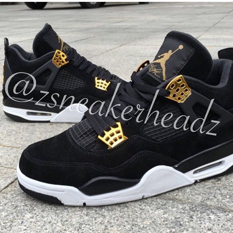 gold and black jordan 4s