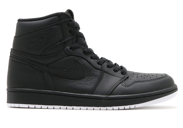 A Detailed Look At The Blacked Out And Perforated Jordan Sneakers mixmatched pair of original PSG Jordan 1s2 Retro Rosso