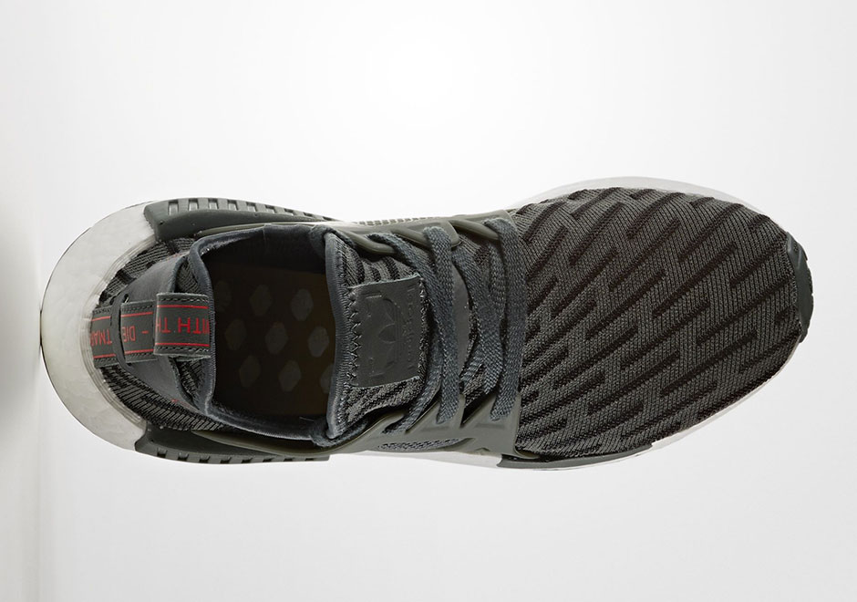 nmd cs1 black and red