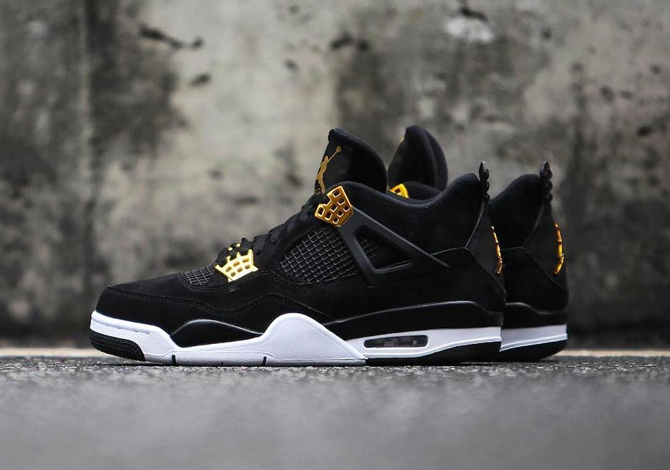 gold and black jordan 4s