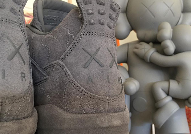 First Look At The KAWS x Air Jordan 4 In Grey Suede