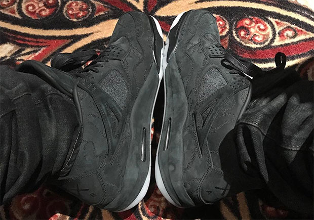 Drake Reveals His Black KAWS x Air Jordan 4