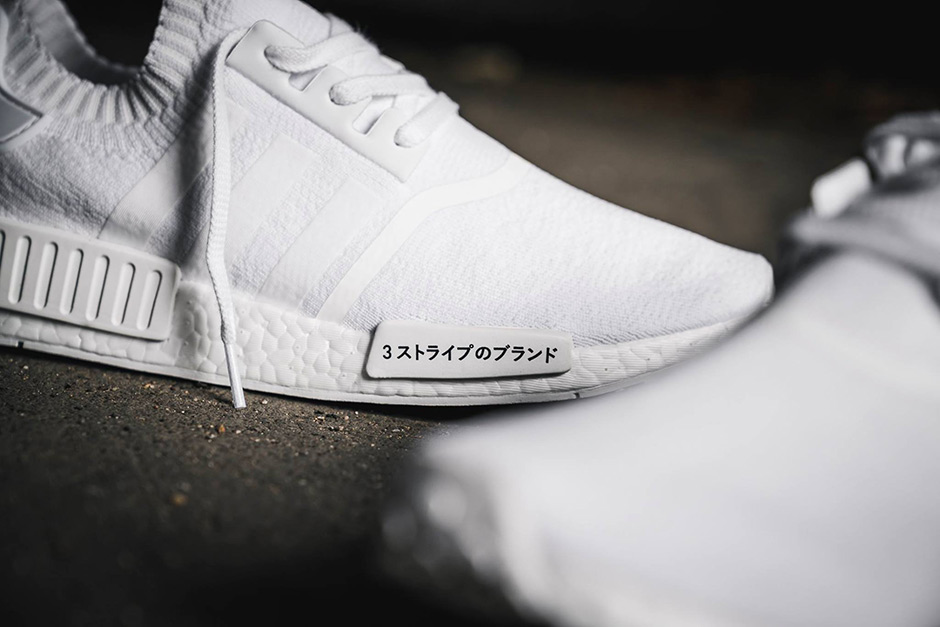 nmd black with white writing