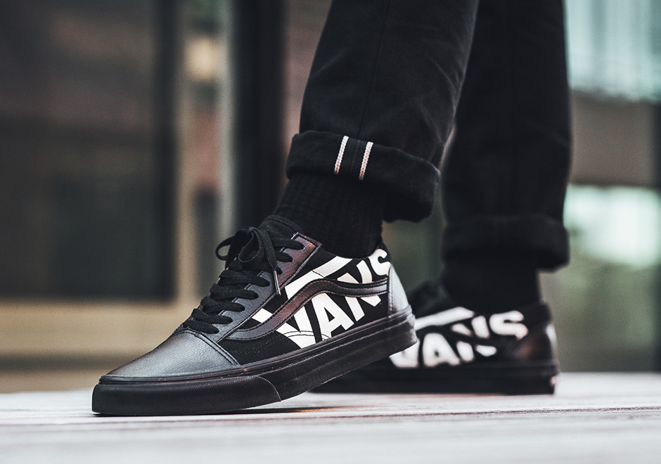 black vans with white writing