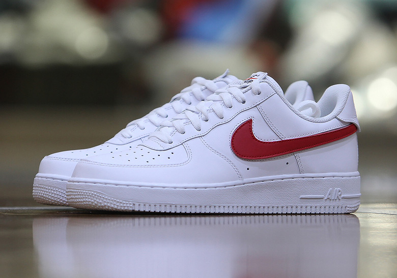 air force 1 with red nike sign