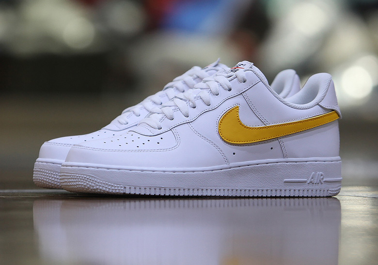 nike air force with yellow swoosh