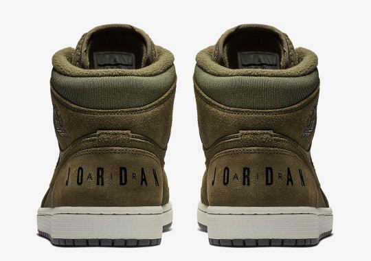 This Fleece-Tongued Air Jordan 1 Mid Features Another Classic Logo On The Heel