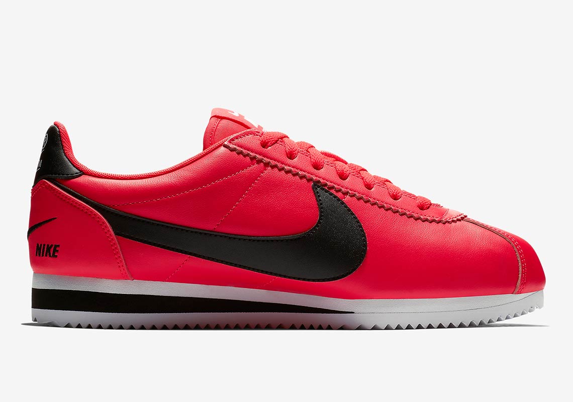 white nike cortez with red swoosh