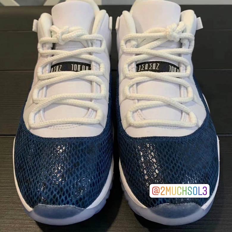 jordan 11 low navy snakeskin on feet