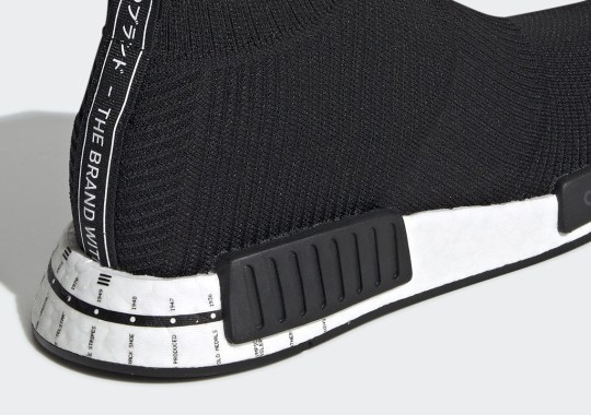 This adidas crimson NMD CS1 Features The Brand’s Entire Timeline On The Heel
