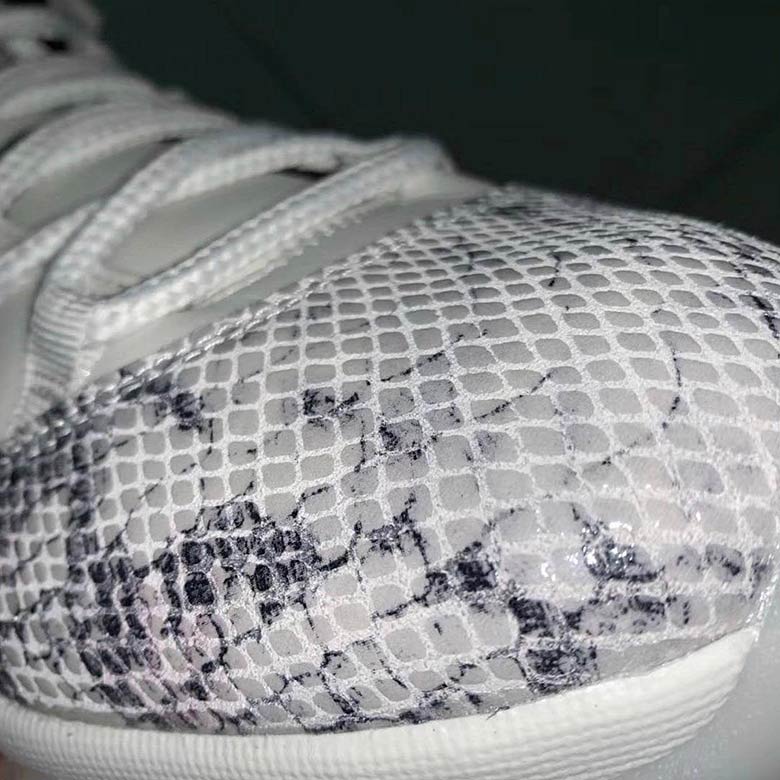 grey and white snakeskin 11s