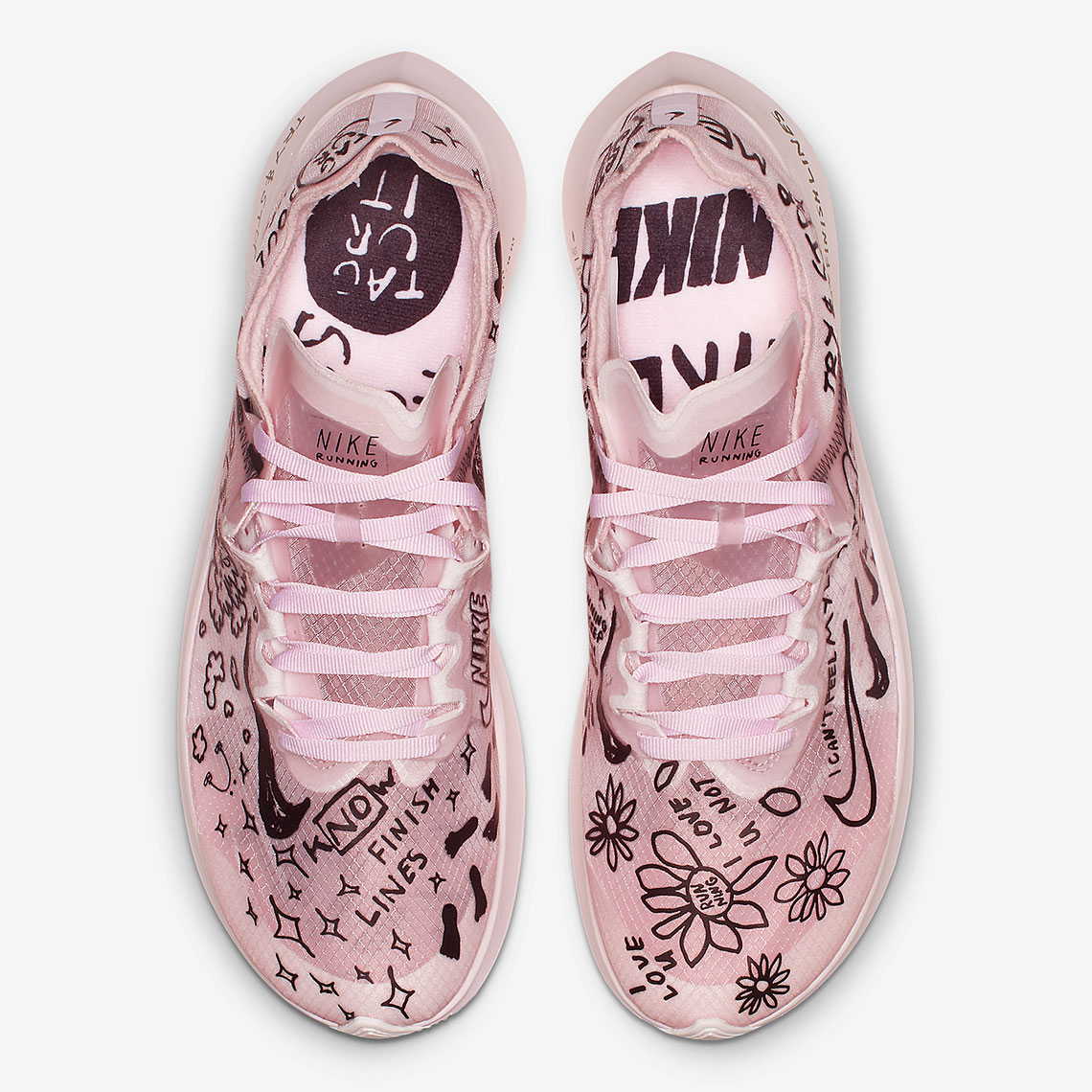 pink nike shoes with writing