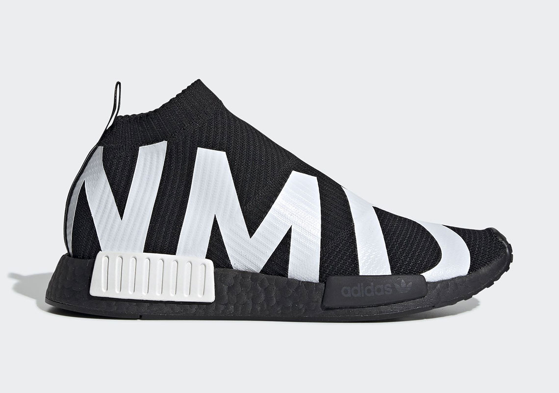 black nmd with white writing