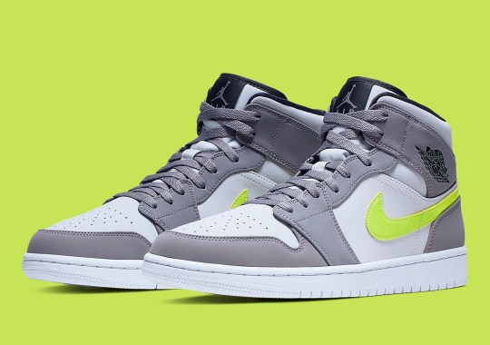 The Ubiquitous Air Jordan 1 Mid Appears In Grey And Volt