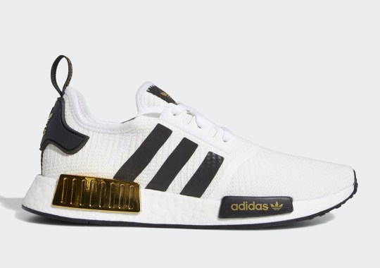 The adidas NMD R1 Gets Glossy Metallic Gold Bumpers