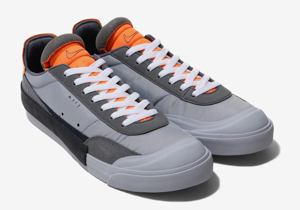 Nike’s Drop Type LX Appears In Wolf Grey And Orange