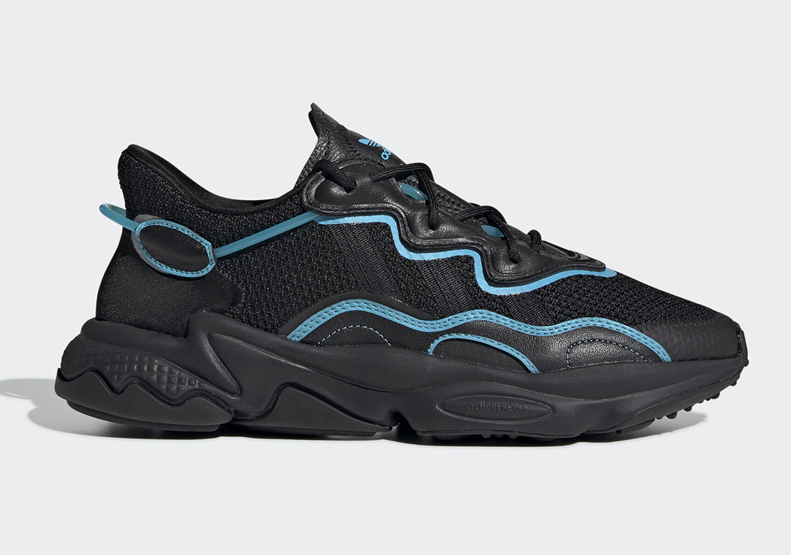 The adidas Ozweego Gets Bright Cyan Piping On A Black Upper