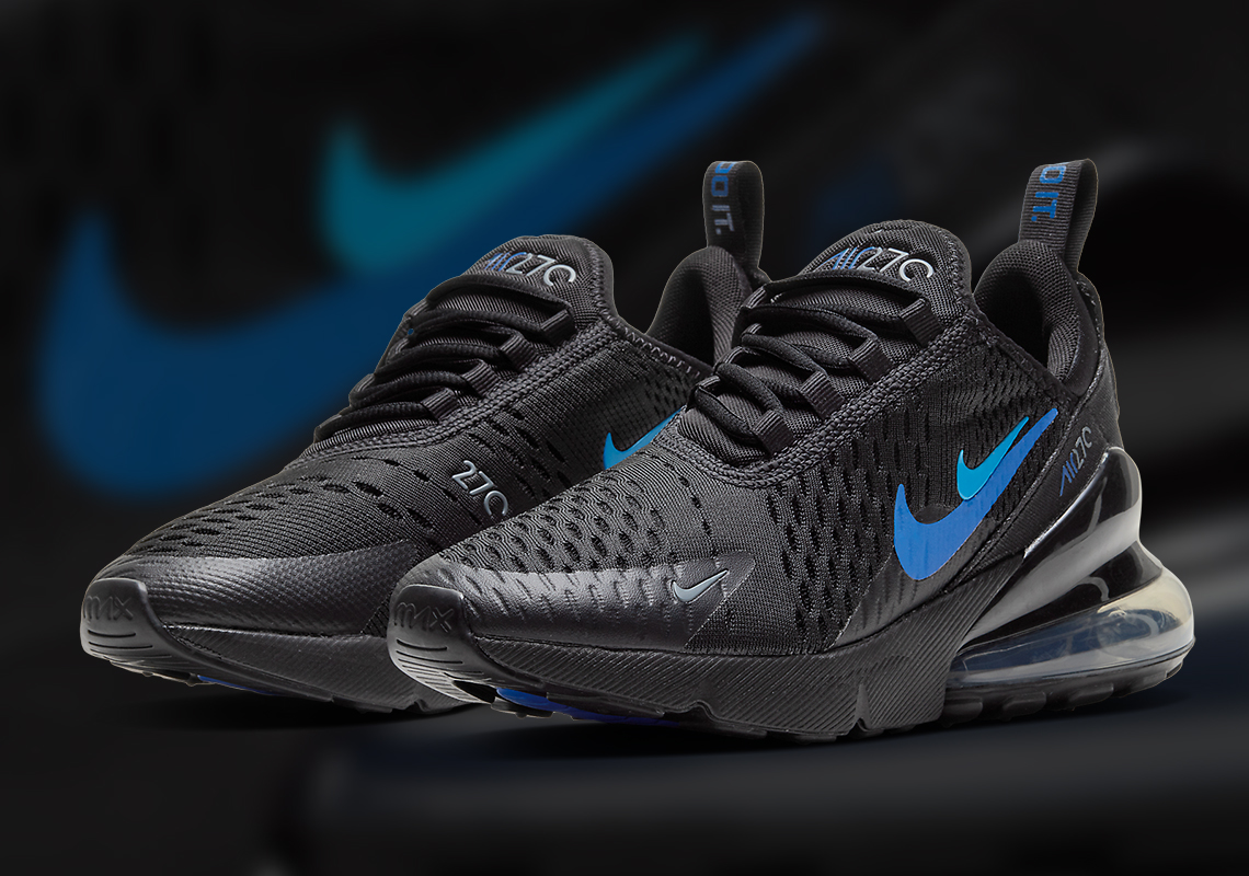 black nikes with blue swoosh