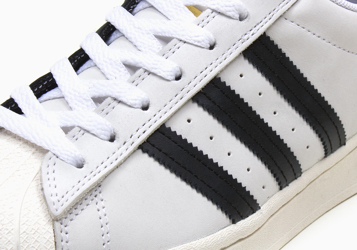 The Iconic White and Black adidas Superstar Combine Into One Split ...