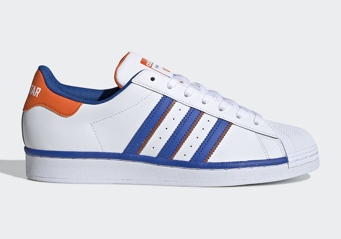 adidas trainers blue with orange stripes