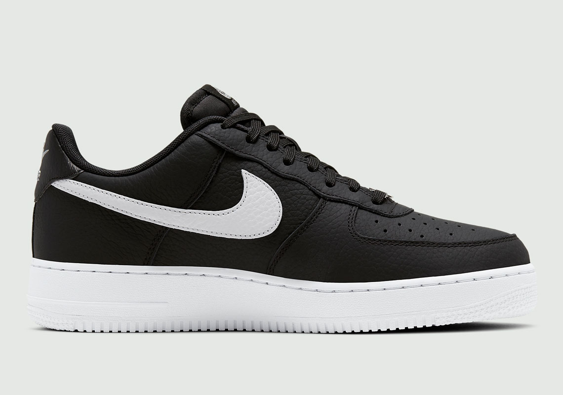 air forces with black nike sign