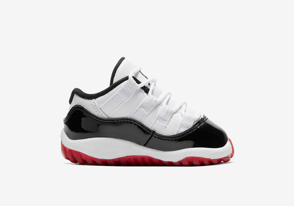 red black and white low top jordans 11