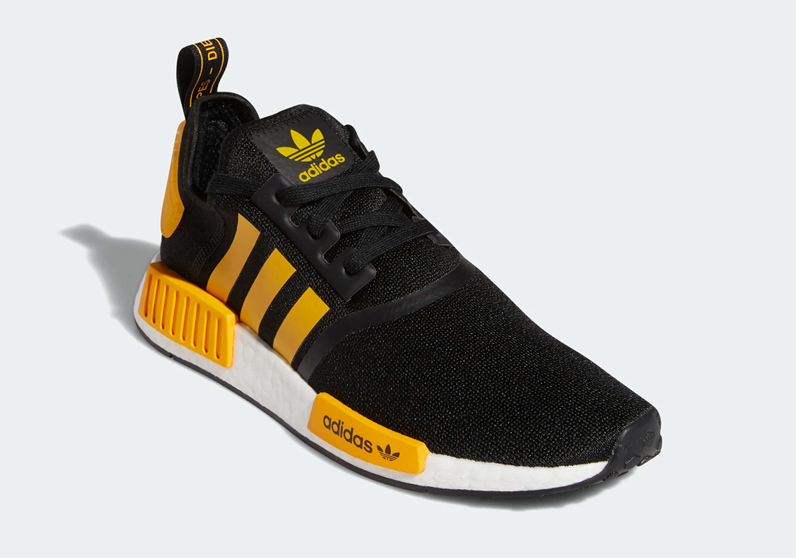 nmd r1 black and yellow