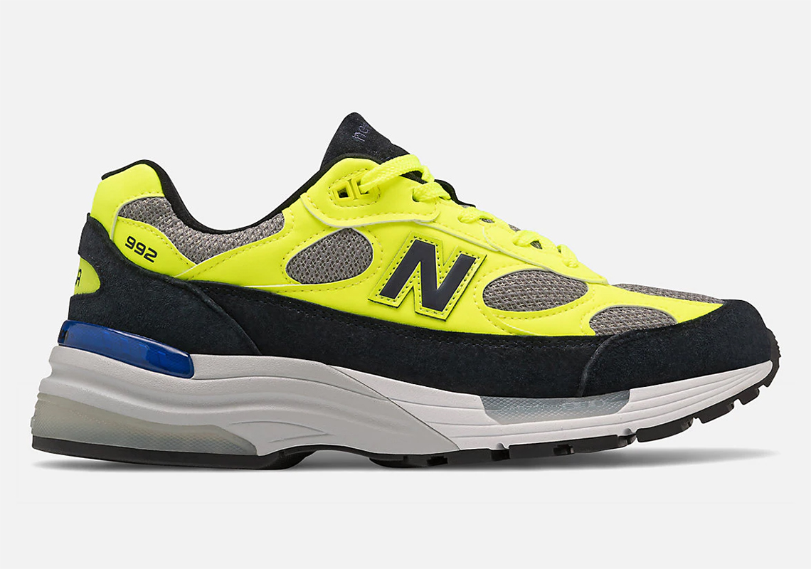 black and yellow new balance shoes