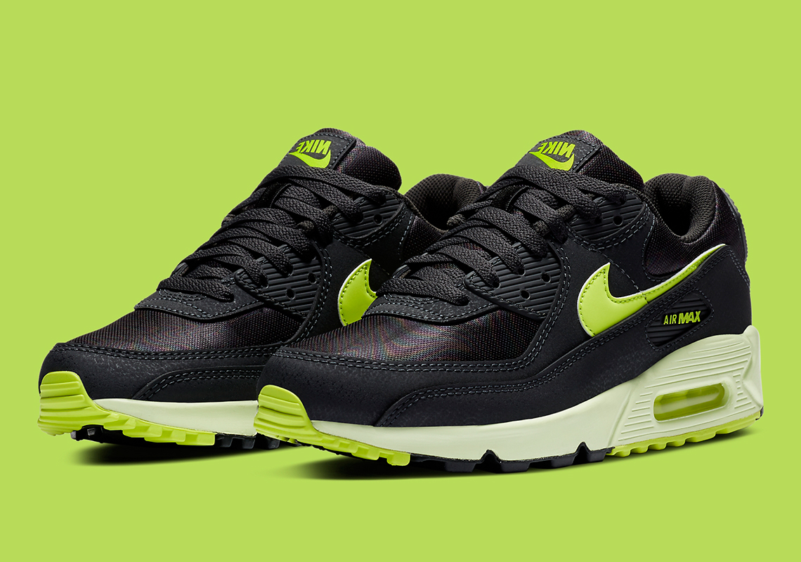 black nike shoes with green tick