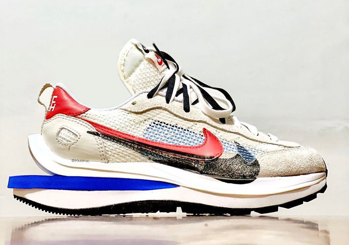 The sacai x Nike Vapor Waffle Emerges In Royal And Red Accents