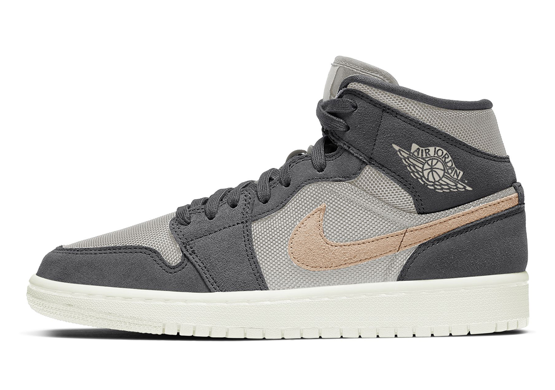 The Air Jordan 1 Mid Applies Light Tan Swooshes To A Grey-Dressed Women's Exclusive
