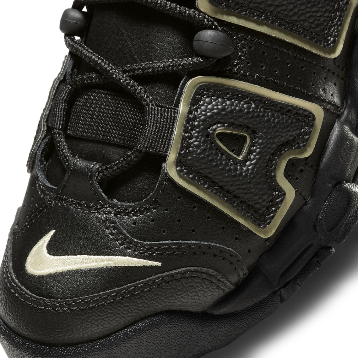 nike uptempo black and gold