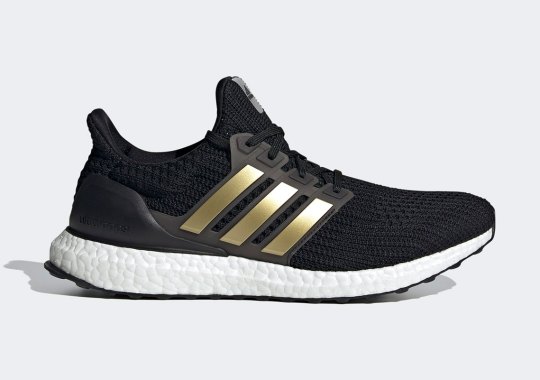 The white adidas Ultra Boost 4.0 DNA Adds Metallic Gold Stripes