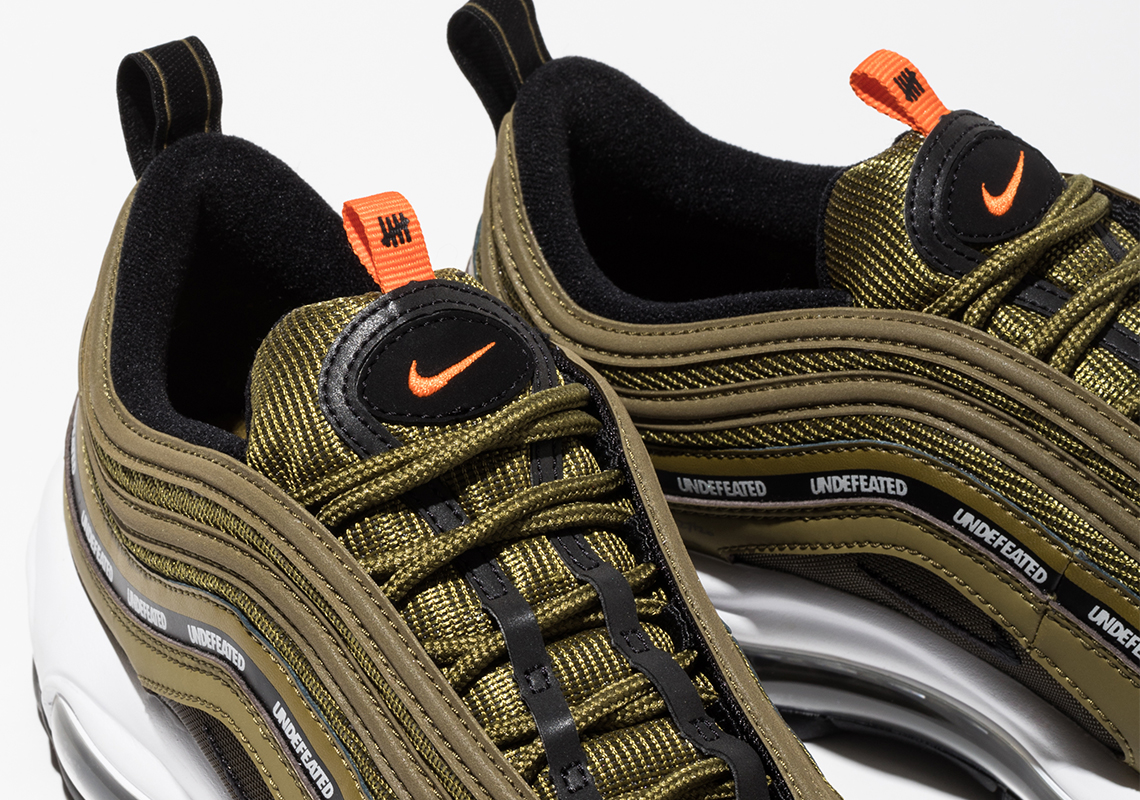olive green and orange air max 97