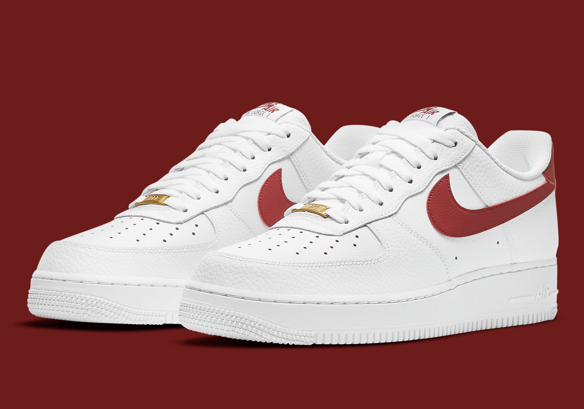 white nike shoes with red swoosh