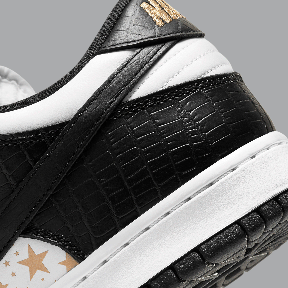 Supreme Nike SB Dunk Low White Black DH3228-102 | SneakerNews.com