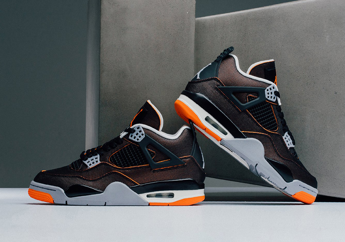 orange and black jordan 4