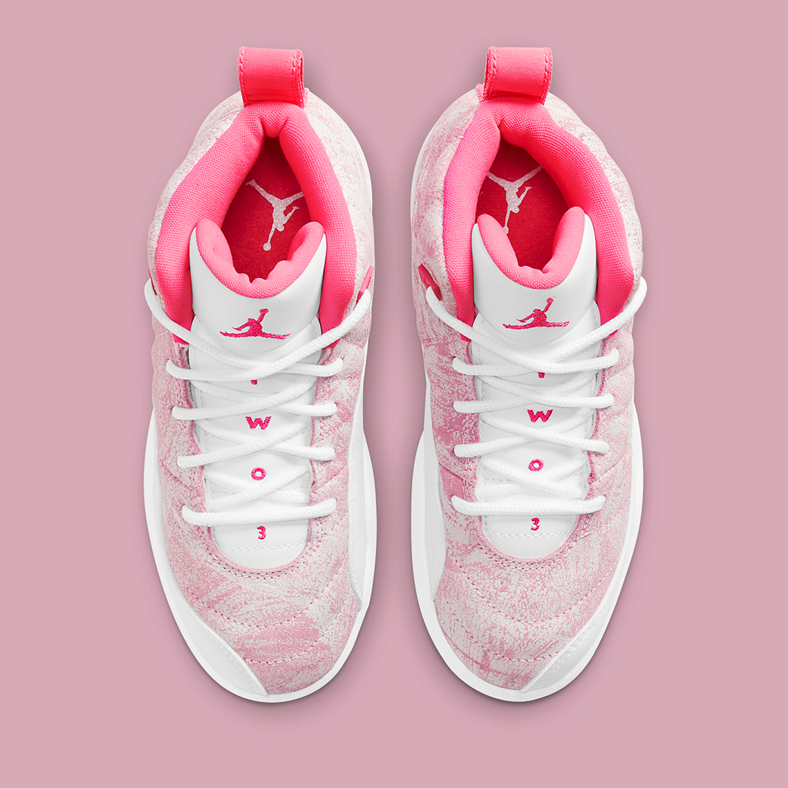 pink and white jordan retro 12